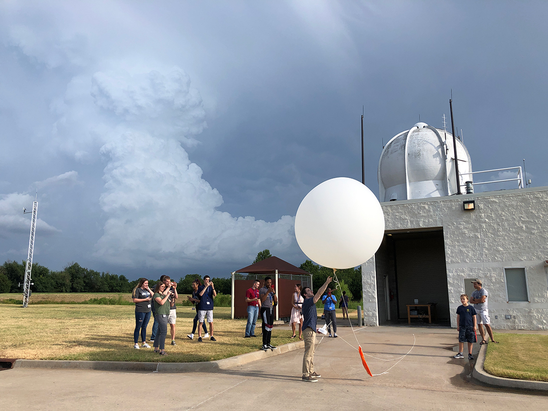 Photo of group watching a NWS balloon launch